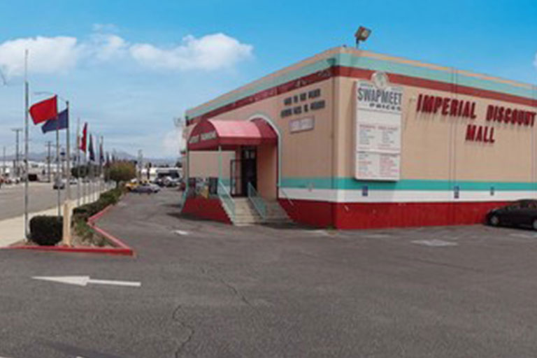 Imperial Discount Mall exterior with flags.