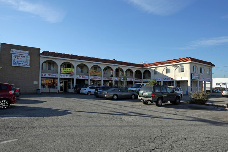 Outdoor view of a small shopping plaza.