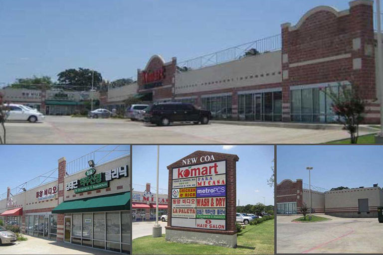 Shopping center with various store signs visible.