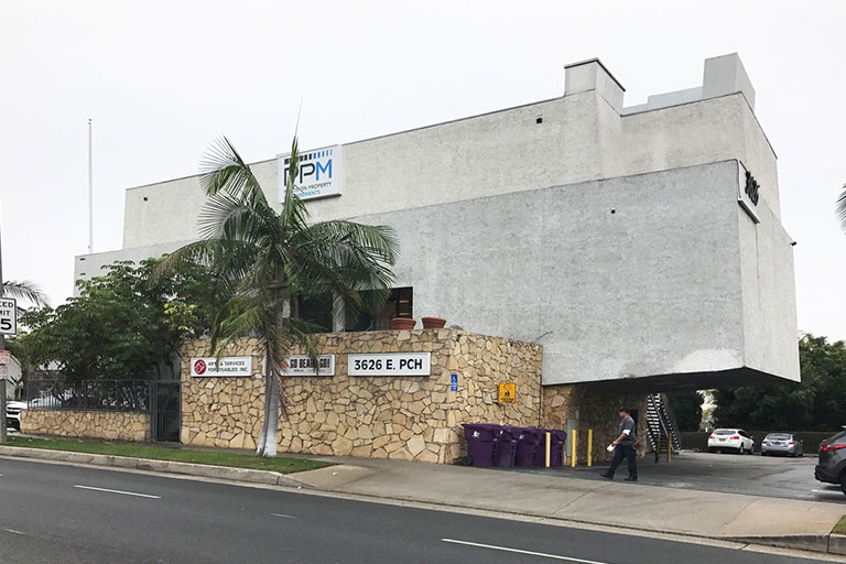 Modern building with stone and stucco facade.