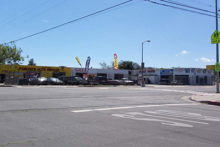 Auto repair shops along a street corner.