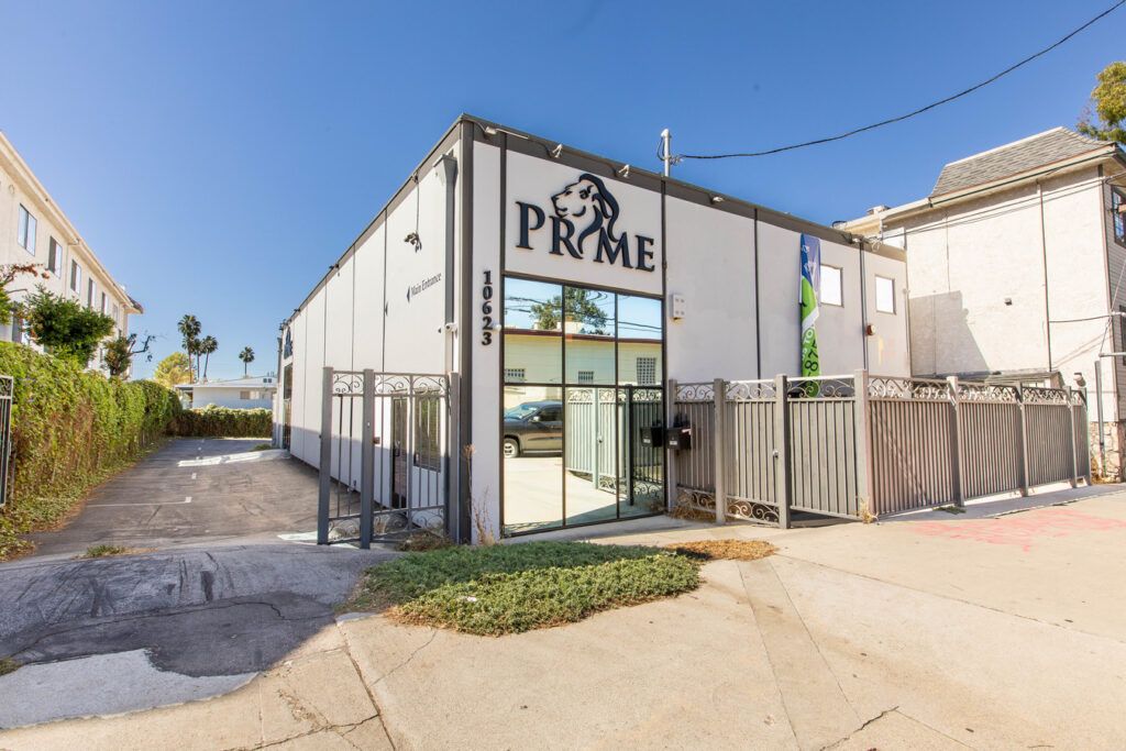 Modern building with "Prime" sign on facade.