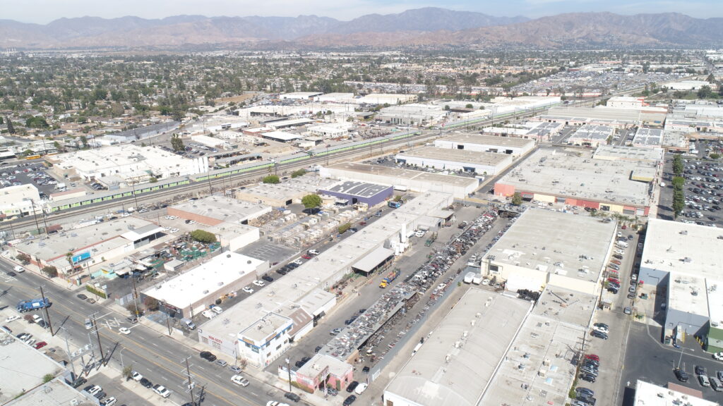 Aerial view of industrial area and mountains.