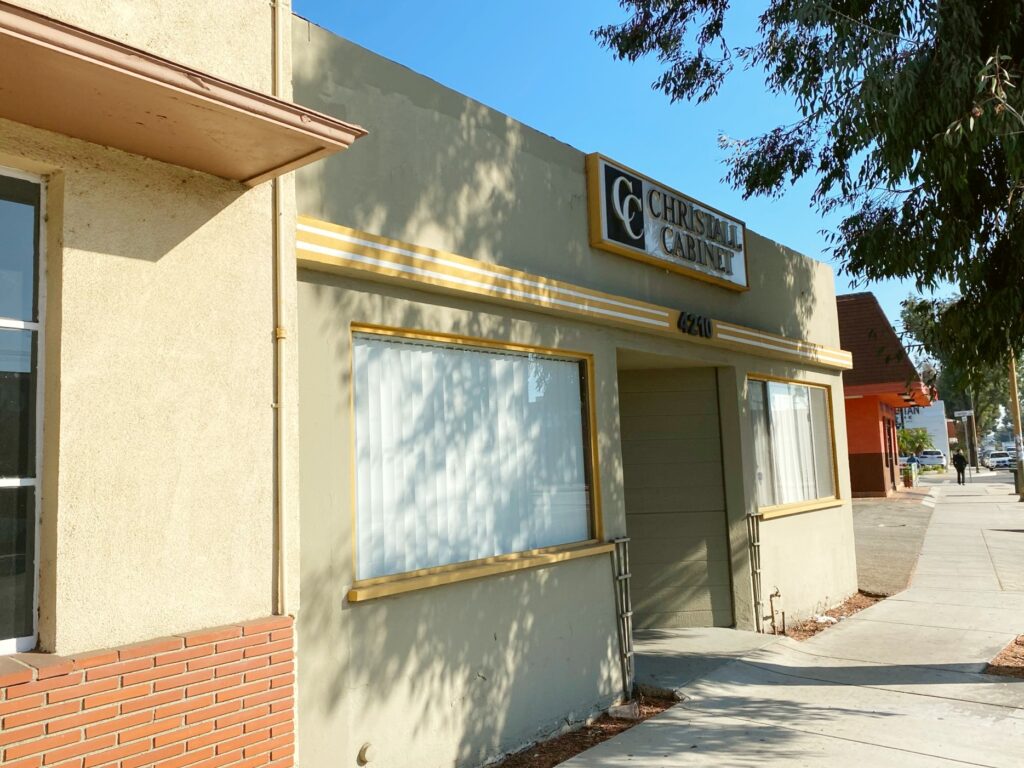 Beige building with a clinic sign.