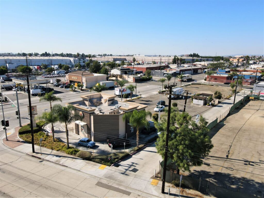 Aerial view of urban intersection and buildings.